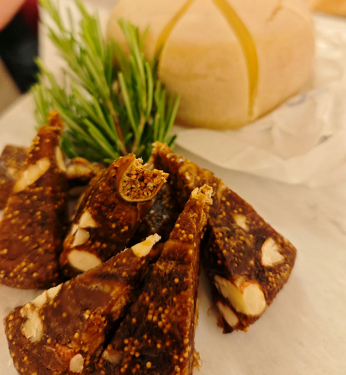 Fig-and-almond salami with pecorino and rosemary.