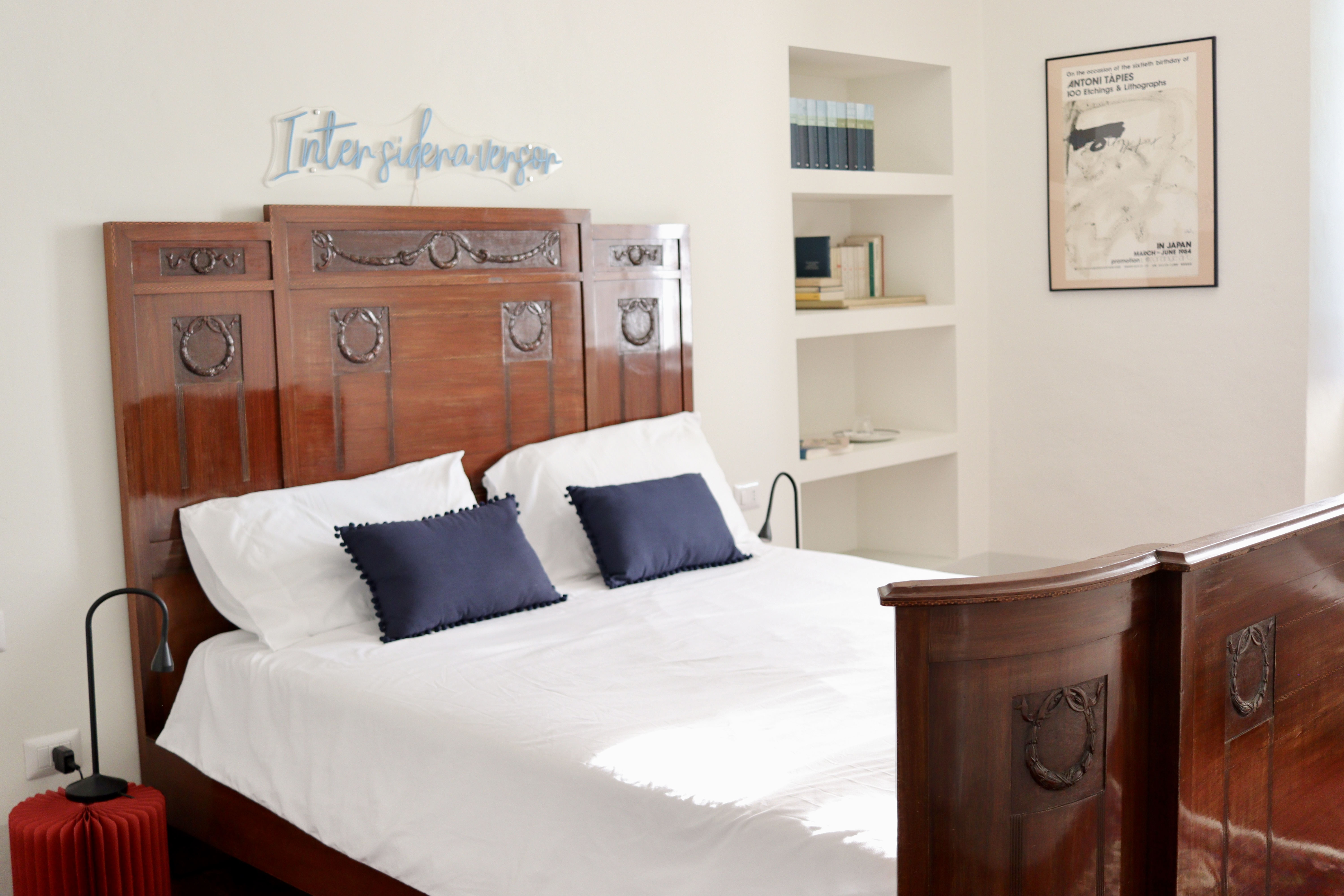 Master bedroom — antique carved bed, original frescoes.