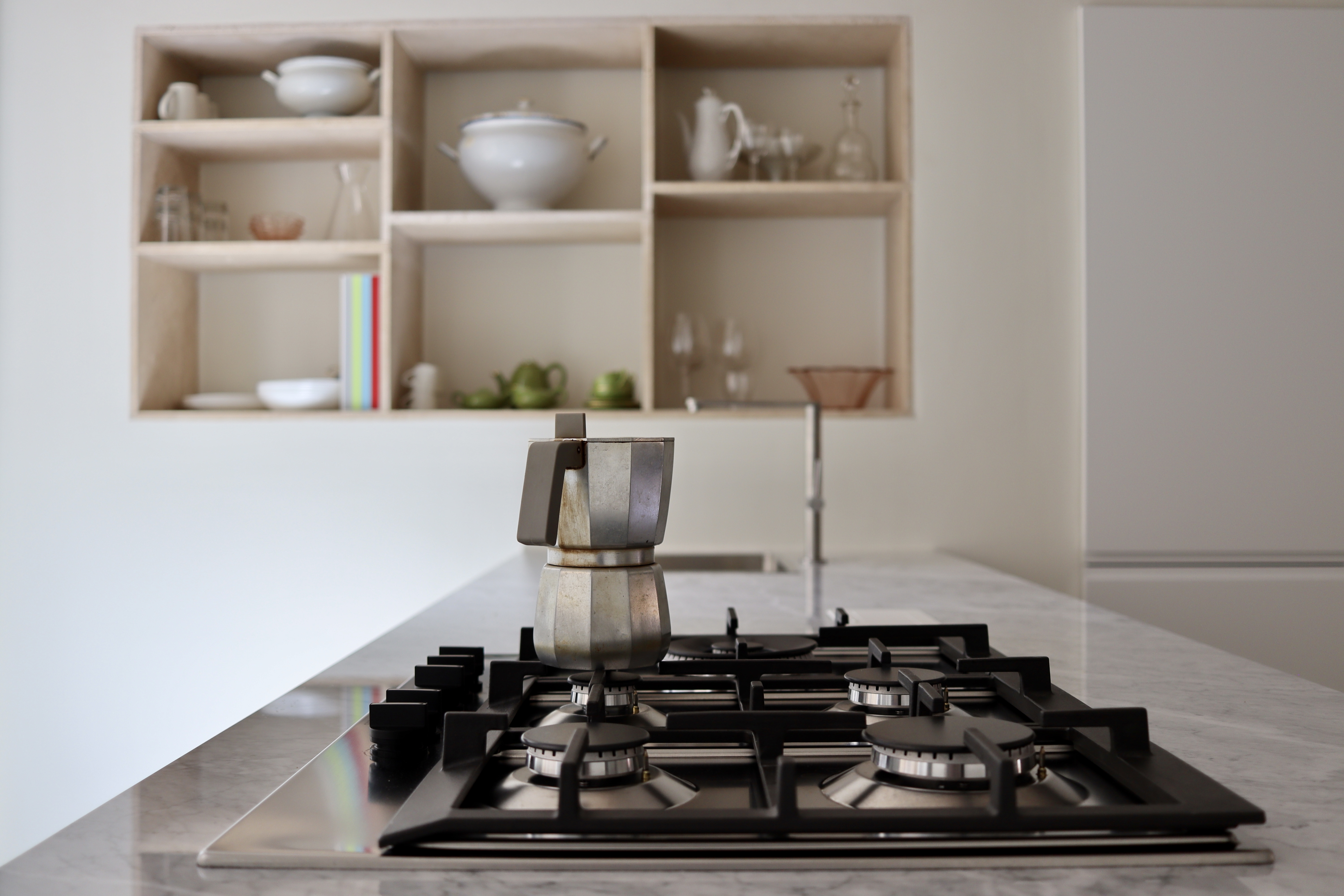 Kitchen — moka pot, warm and domestic.